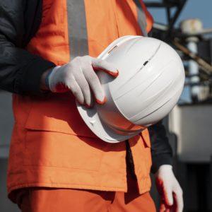 close up hand holding safety helmet 300x300