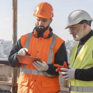 medium shot men looking at tablet 300x300